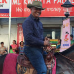 General Mark Supnet rides by with a smile.